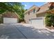 Long driveway leads to a 3 car garage with plenty of parking space at 21 Highbush Ct, Sharpsburg, GA 30277