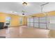Spacious two-car garage with epoxy floor, windows and automatic door at 21 Highbush Ct, Sharpsburg, GA 30277