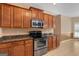Kitchen showcases stainless steel oven and microwave, granite counters, and wood cabinets at 21 Highbush Ct, Sharpsburg, GA 30277