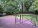 The backyard features a patio, grass, mature trees, and a shed at 7336 Howard Cir, Jonesboro, GA 30236