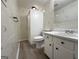 Cozy bathroom featuring classic floral wallpaper, a practical shower stall, a commode and a vanity sink with storage at 7336 Howard Cir, Jonesboro, GA 30236