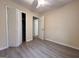 Bedroom featuring modern floors, neutral walls, ceiling fan and closet at 7336 Howard Cir, Jonesboro, GA 30236