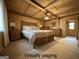 Virtually staged bedroom with vaulted ceilings, a wooden paneled wall, and a large window for natural light at 7336 Howard Cir, Jonesboro, GA 30236