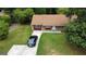 Charming single-story home featuring a brick facade, well-maintained lawn, and a private driveway with parking at 7336 Howard Cir, Jonesboro, GA 30236