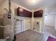 This laundry room has a water heater, overhead cabinets, and a washer hookup at 7336 Howard Cir, Jonesboro, GA 30236