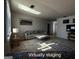 Virtually staged living room featuring a neutral color scheme, comfortable seating, and a decorative rug at 7336 Howard Cir, Jonesboro, GA 30236
