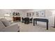 Finished basement with game area, foosball table, and cozy seating; great for recreation and relaxation at 737 Myrica Ave, Locust Grove, GA 30248