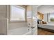 Relaxing bathroom featuring a soaking tub next to the Main Bedroom at 737 Myrica Ave, Locust Grove, GA 30248