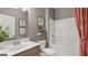 Bathroom with vanity and shower-tub combo, accented by stylish décor and a decorative shower curtain at 737 Myrica Ave, Locust Grove, GA 30248