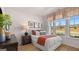 Comfortable bedroom with a large window offering an abundance of natural light and outdoor views at 737 Myrica Ave, Locust Grove, GA 30248