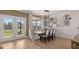 Elegant dining room with stylish chandelier, seating for six, and french doors leading to outdoor patio at 737 Myrica Ave, Locust Grove, GA 30248