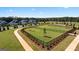 Spacious dog park featuring lush green grass, a secure fence, and walking paths at 737 Myrica Ave, Locust Grove, GA 30248