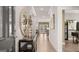 Welcoming entryway with console table, stylish mirror, and views into the adjoining dining and living areas at 737 Myrica Ave, Locust Grove, GA 30248