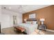 Spacious main bedroom with wood floors, contemporary furnishings, and an ensuite bathroom at 737 Myrica Ave, Locust Grove, GA 30248