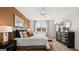 Bright main bedroom showcasing stylish bedding, modern decor, and ample natural light at 737 Myrica Ave, Locust Grove, GA 30248