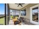 Cozy screened porch with stylish furniture, ideal for outdoor relaxation at 737 Myrica Ave, Locust Grove, GA 30248