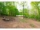 Wide angle view of the home's back yard surrounded by lush green trees at 215 Ridge Rd, Tyrone, GA 30290