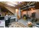Unfinished basement with exposed ceiling, office, stairs, and storage, offering customization at 215 Ridge Rd, Tyrone, GA 30290