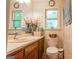Bathroom with unique clock and window at 215 Ridge Rd, Tyrone, GA 30290