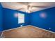 Bedroom with ceiling fan and window at 215 Ridge Rd, Tyrone, GA 30290