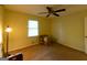 Comfortable bedroom with a ceiling fan, window, closet and room for furnishings at 215 Ridge Rd, Tyrone, GA 30290