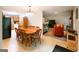 Open-concept dining area connected to the kitchen and living room, bathed in natural light at 215 Ridge Rd, Tyrone, GA 30290