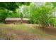 Charming brick home nestled in a wooded setting, offering privacy and serene surroundings at 215 Ridge Rd, Tyrone, GA 30290