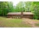 Well-maintained brick home with a traditional design, front yard, and mature landscaping at 215 Ridge Rd, Tyrone, GA 30290