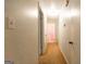 Long hallway with carpet and neutral paint at 215 Ridge Rd, Tyrone, GA 30290