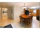 Eat-in kitchen featuring an oak table and black appliances at 215 Ridge Rd, Tyrone, GA 30290