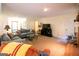 Spacious living room featuring comfortable sofas, a fireplace, and an open layout ideal for entertaining guests at 215 Ridge Rd, Tyrone, GA 30290