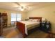 Main bedroom with bed and dressers at 215 Ridge Rd, Tyrone, GA 30290