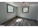 This bedroom is bright and spacious, featuring hardwood floors and two windows at 2016 Conrad Se Ave, Atlanta, GA 30315