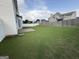 A spacious backyard with a well-maintained lawn and a concrete patio, perfect for outdoor living at 1130 Ivey Ln, Mcdonough, GA 30253