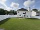Expansive fenced backyard with well-maintained lawn and ample space for outdoor activities at 1130 Ivey Ln, Mcdonough, GA 30253