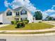 Charming two-story home with manicured lawn, tasteful landscaping, and attached two-car garage at 1130 Ivey Ln, Mcdonough, GA 30253