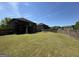 Fenced backyard with a large lawn, backs to other homes at 960 Spanish Moss Trl, Loganville, GA 30052