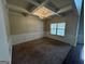 Dining room featuring a coffered ceiling, elegant chandelier, wainscoting, and hardwood flooring at 960 Spanish Moss Trl, Loganville, GA 30052