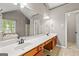 Bathroom showcasing a double vanity and an extra large mirror at 542 Creek Stone Ln, Stone Mountain, GA 30087