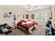 Whimsical bedroom features colorful decor, a ceiling fan, and natural light at 542 Creek Stone Ln, Stone Mountain, GA 30087