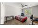 Bedroom featuring a ceiling fan and a window with natural light at 542 Creek Stone Ln, Stone Mountain, GA 30087