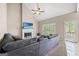 Spacious living room featuring a large sectional sofa and access to an outdoor patio at 542 Creek Stone Ln, Stone Mountain, GA 30087