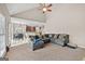 Open-concept living room with view into kitchen and dining, features comfortable sectional seating at 542 Creek Stone Ln, Stone Mountain, GA 30087