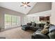 Bright living room showcases large windows, a spacious layout, and open access to other living areas at 542 Creek Stone Ln, Stone Mountain, GA 30087