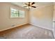 Comfortable bedroom with natural light, carpet flooring, and neutral paint throughout the space at 15 Laurie Ln, Covington, GA 30016