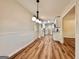 Open concept dining room with wainscoting, modern lighting and access to the kitchen at 15 Laurie Ln, Covington, GA 30016