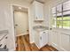 Charming coffee bar with granite top next to a doorway in an updated kitchen design at 15 Laurie Ln, Covington, GA 30016