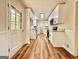 Bright, renovated kitchen with white cabinets, granite countertops and stainless steel appliances at 15 Laurie Ln, Covington, GA 30016