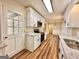 Modern kitchen with stainless steel appliances, granite countertops and access to the back yard at 15 Laurie Ln, Covington, GA 30016