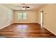 Well-lit living room boasting wood-look floors and a ceiling fan for comfortable living at 15 Laurie Ln, Covington, GA 30016